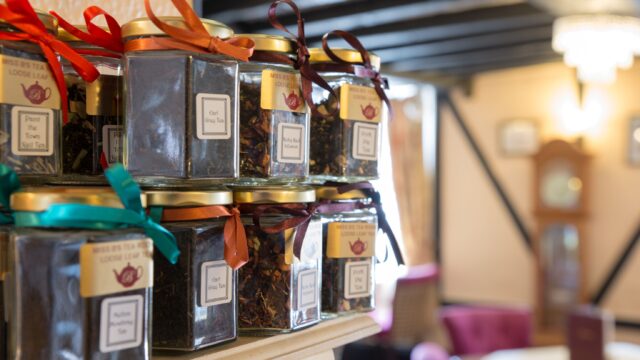 Jars of tea leaves on a self