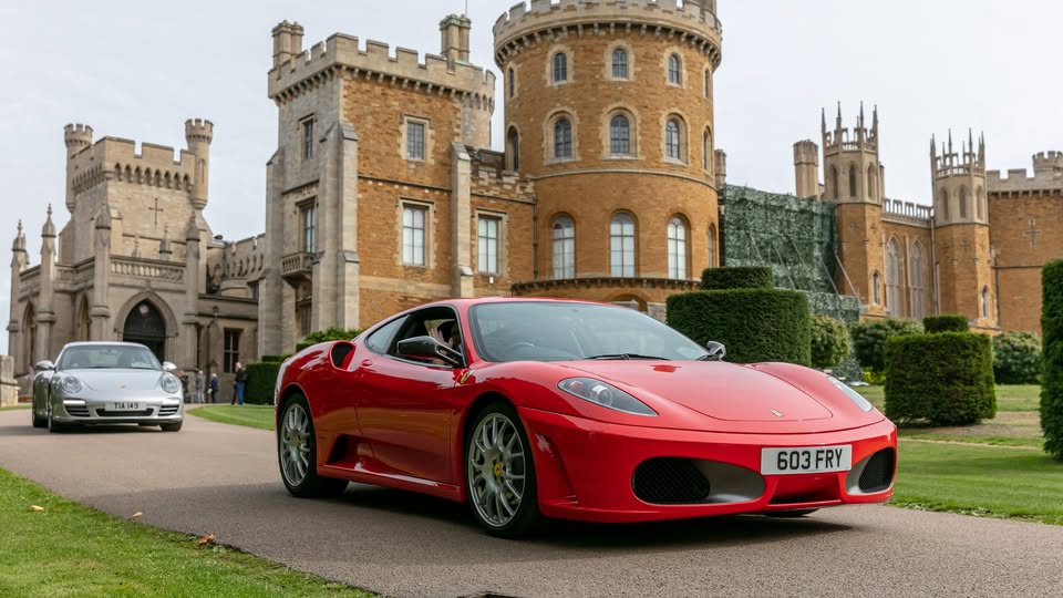 Red sports car in front of Belvoir castle