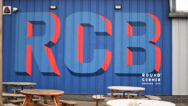 Side of a building with large letters RCB