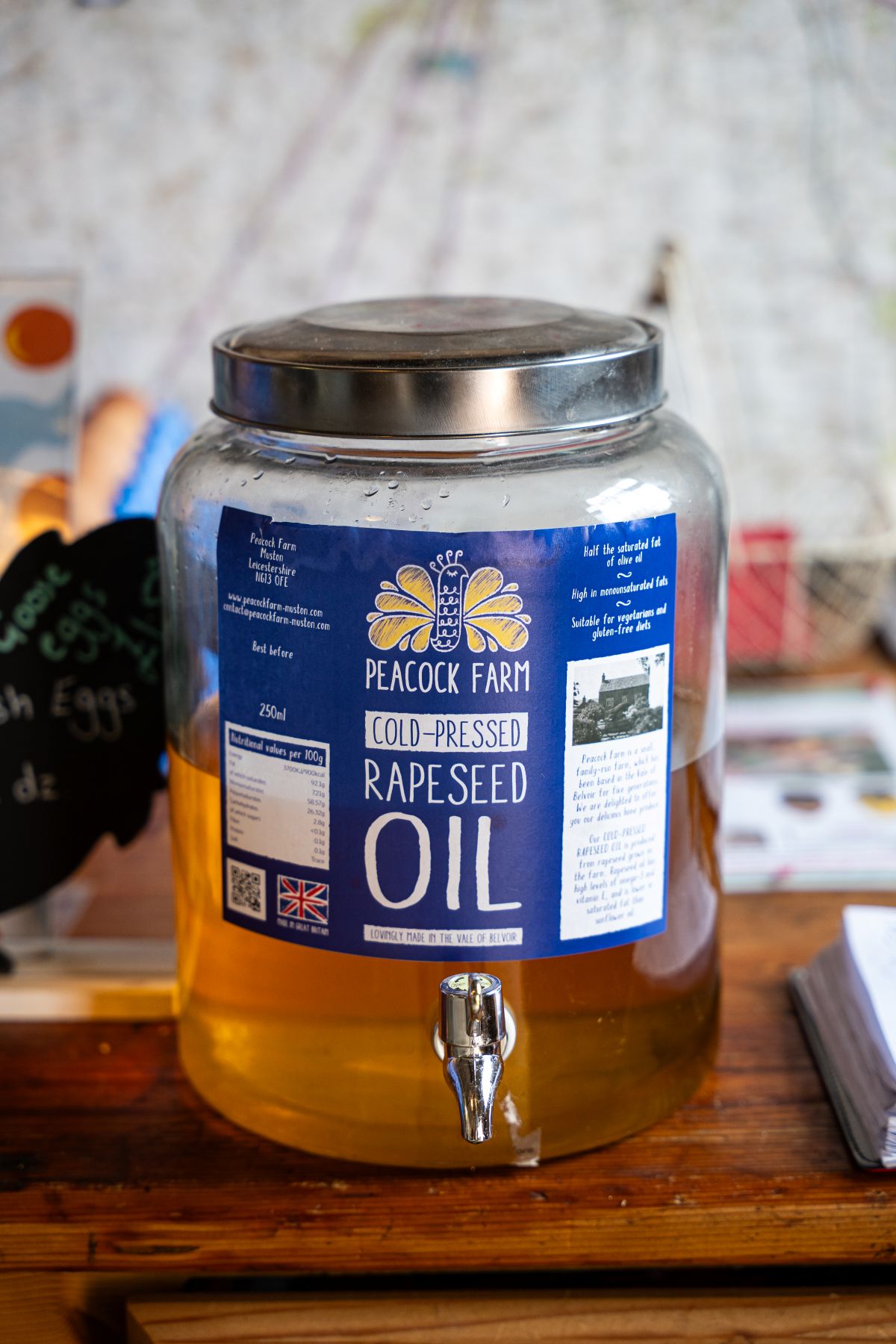 Jar of Peacock farm cold pressed rapeseed oil with a pouring tap