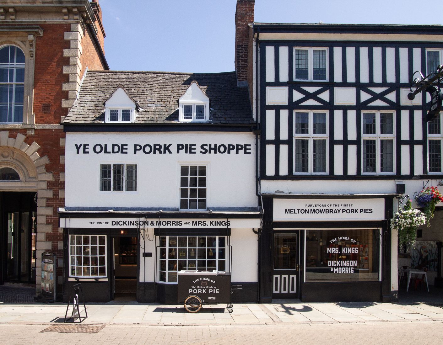 Ye Olde Pork Pie Shoppe exterior in Melton Mowbray during 175 year anniversary celebration showcasing historic shopfront and pork pie heritage