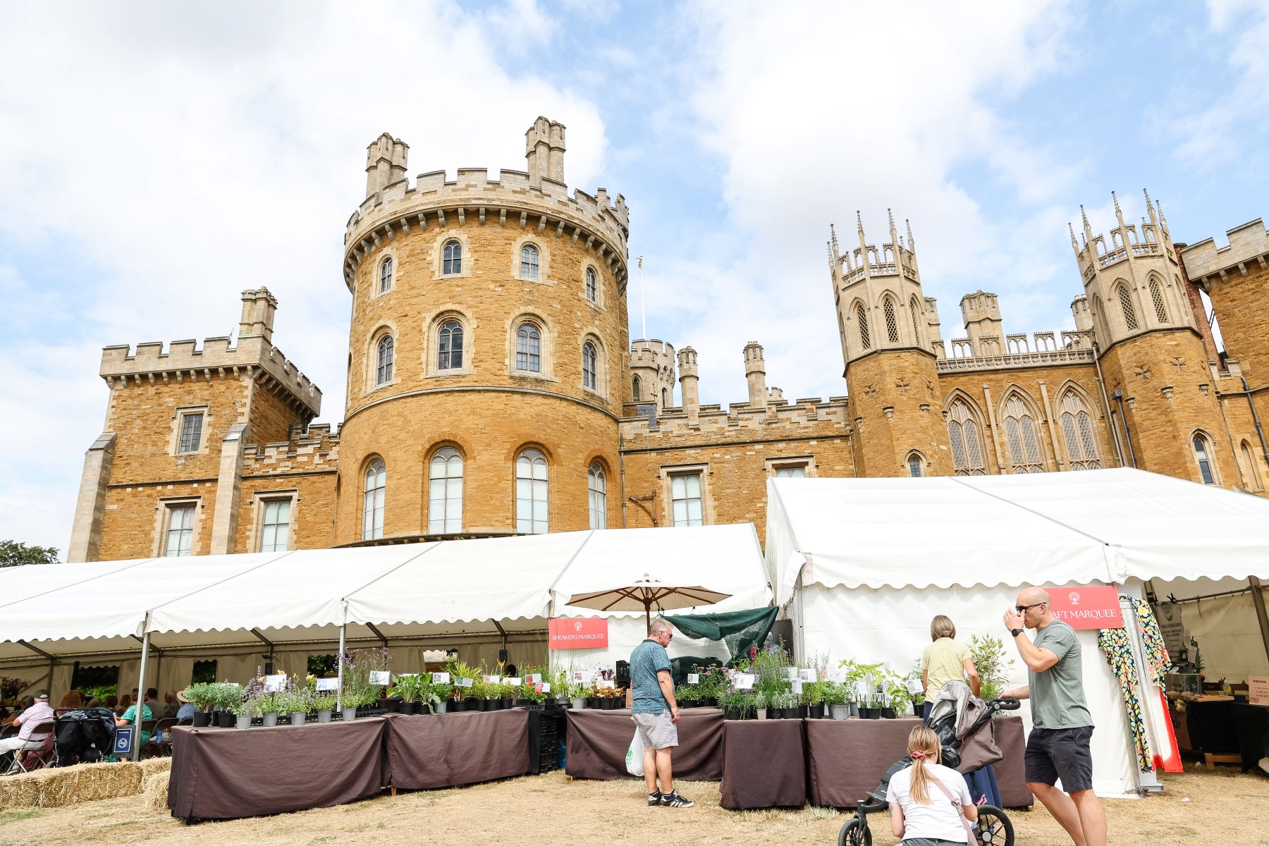 Belvoir Castle Flower & Garden Show 2025 Visitors browse plant stalls and exhibition tents in front of Belvoir Castle at the Flower and Garden Show.