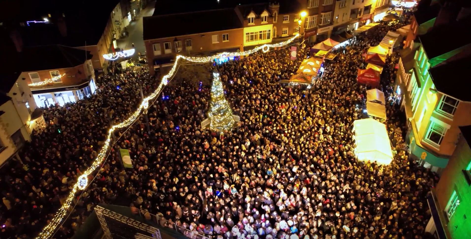 Aerial view of crowds enjoying the Melton Mowbray Victorian Christmas Market and lights switch-on.