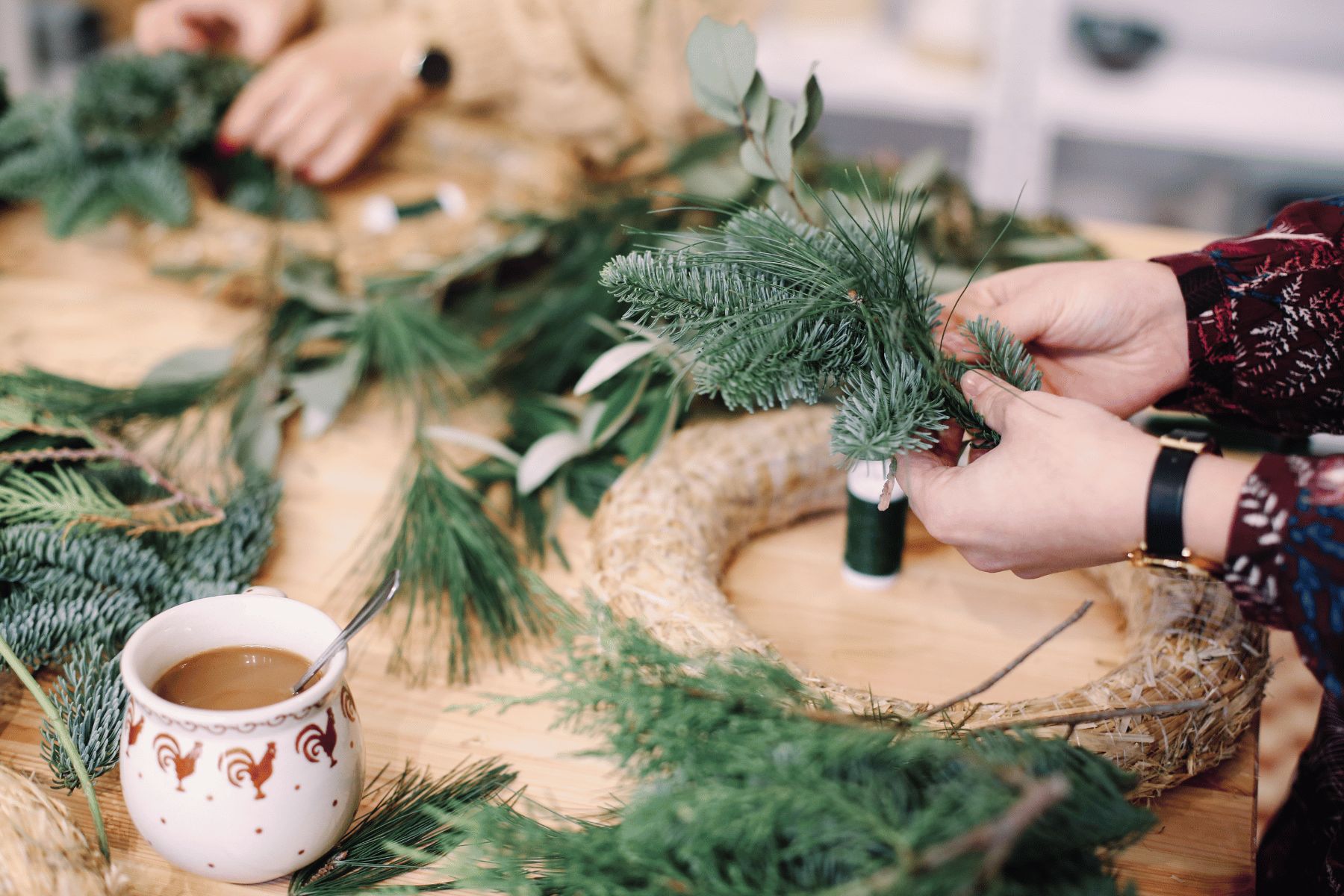 People making a christmas wreath